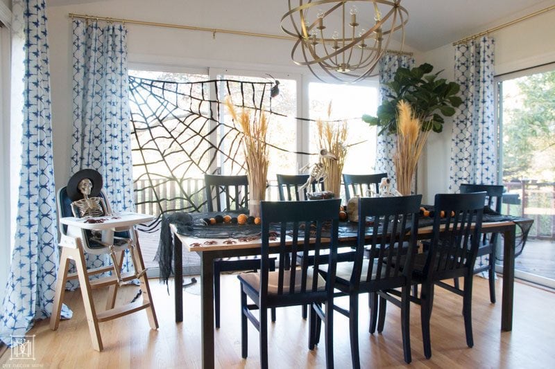 halloweentable decorations and halloween tablescape in breakfast room with skeleton