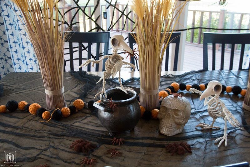 halloween decor ideas for table kids party with skeletons, skulls, and spiders