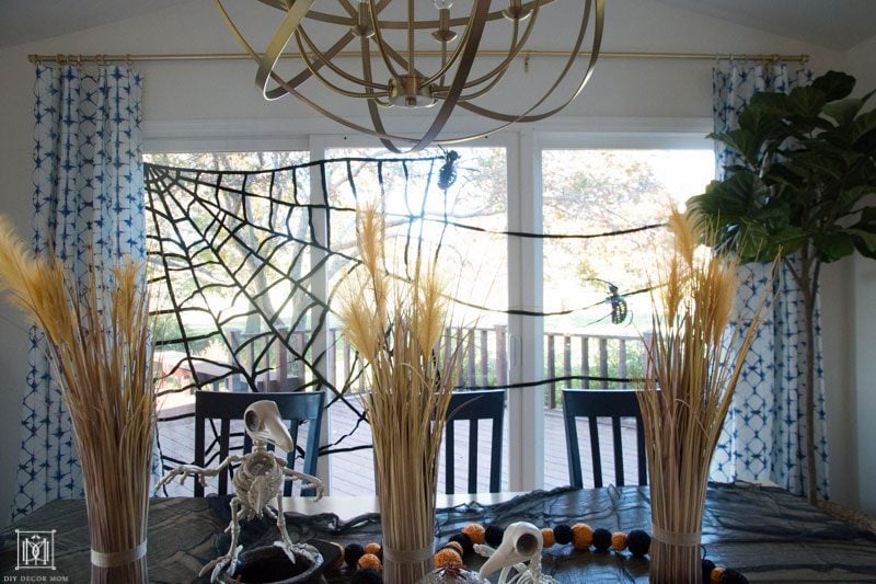 breakfast table decorated with halloween decor ideas and skeletons