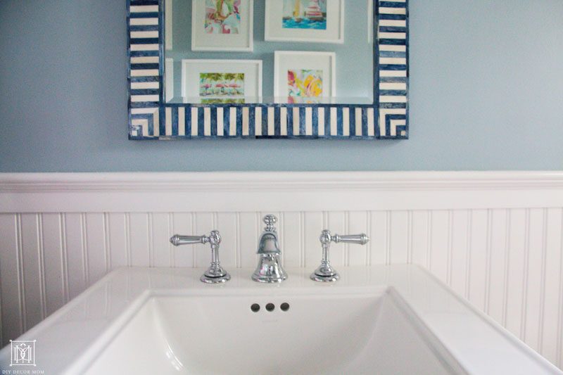 add artwork to make a small bathroom seem bigger