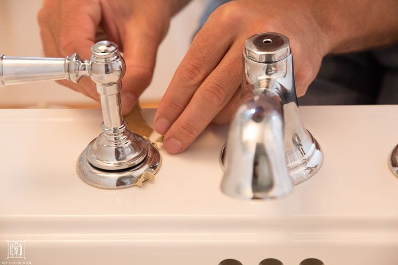 tips for making a small bathroom look bigger like installing matching faucets on pedestal sink