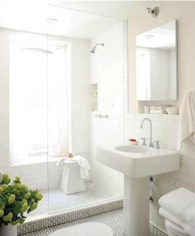 airy light greige walls in bathroom with subway tile and pedestal sink