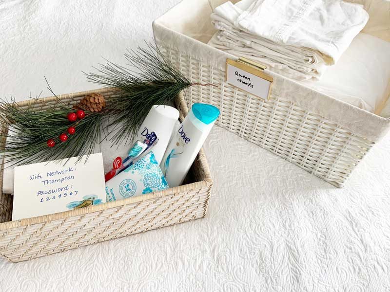 organized linen closet with guest room welcome basket