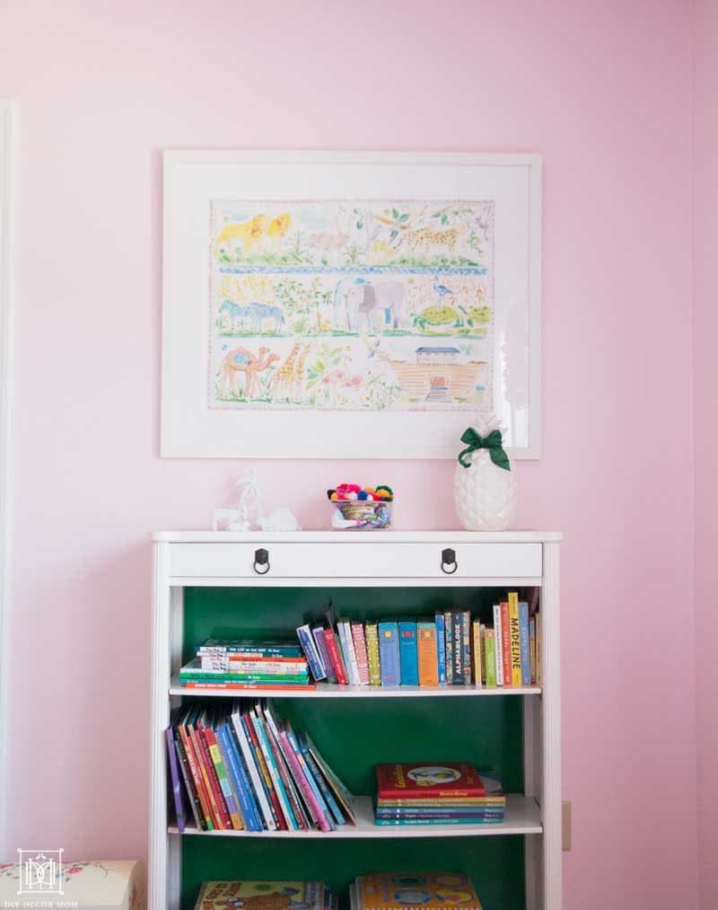 little-girls-room-with-pink-walls-and-vintage-green-and-white-bookcase