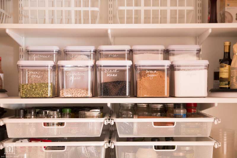 organized baking supplies in pantry with deep shelves