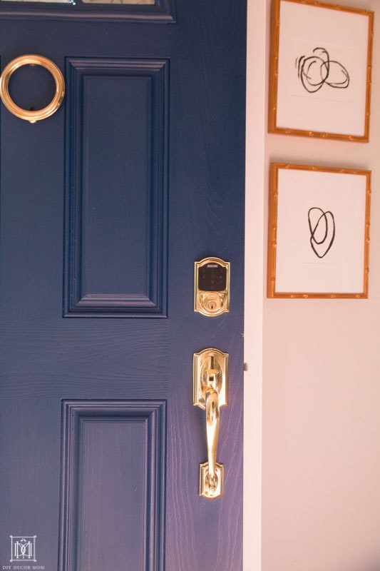 wipe down door hardware- gold hardware on blue door for spring cleaning checklist and calendar