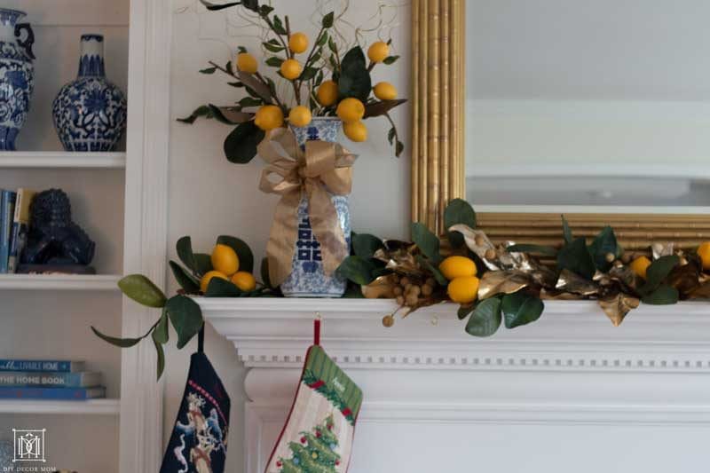 faux lemons and citrus garland on fireplace mantel 