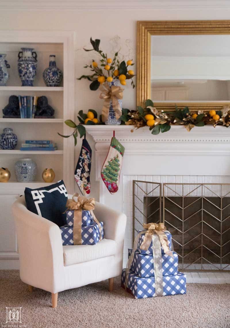 christmas fireplace with lemon garland and blue and white pottery