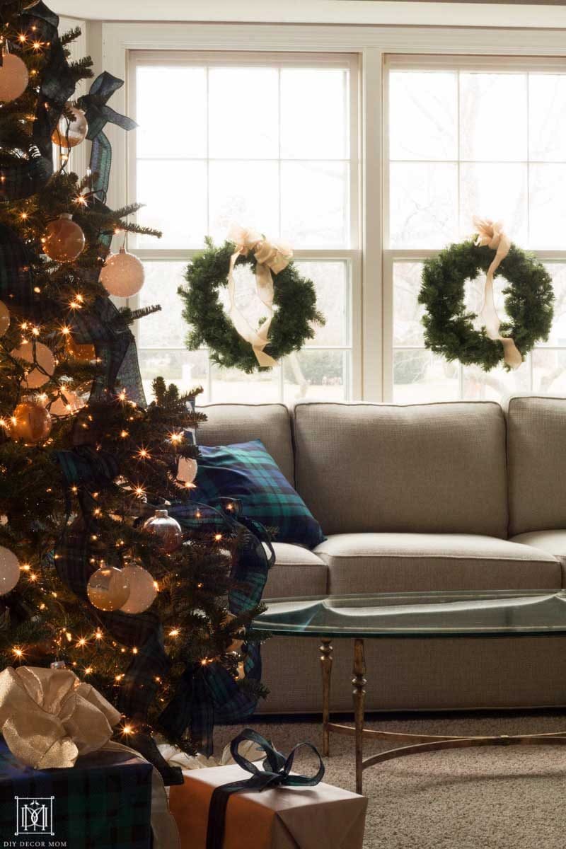 plaid christmas decorations with wreaths on window