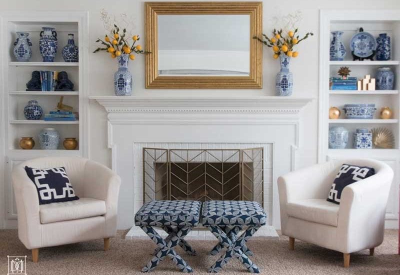 how to decorate a bookcase- white painted built ins and painted brick fireplace