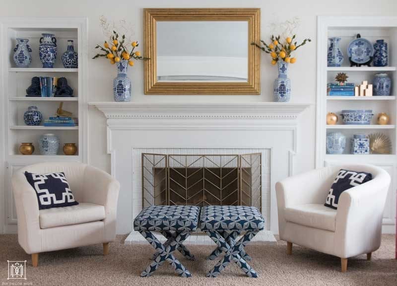 warm white walls with blue and white pottery and fireplace