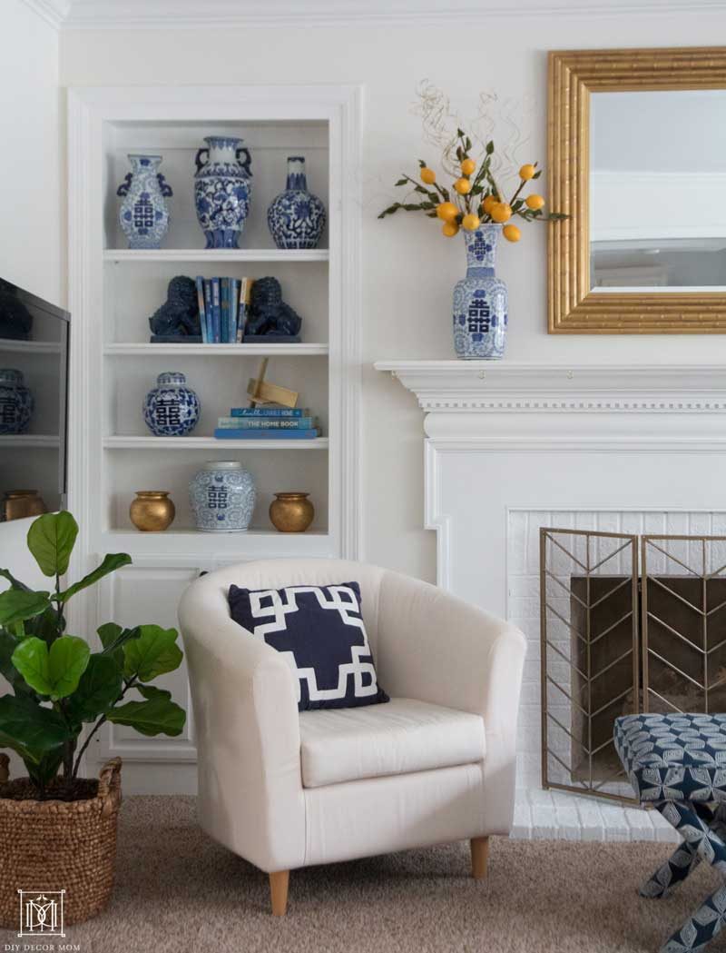 how to style bookshelves--white painted built in bookcases with blue and white pottery