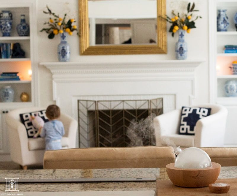 how to make your house smell good- picture of a diffuser with fireplace in background