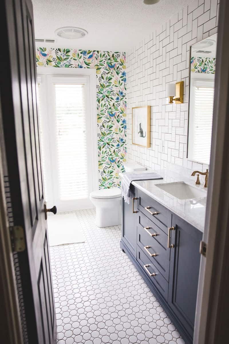 gorgeous wallpaper and tiled girls bathroom