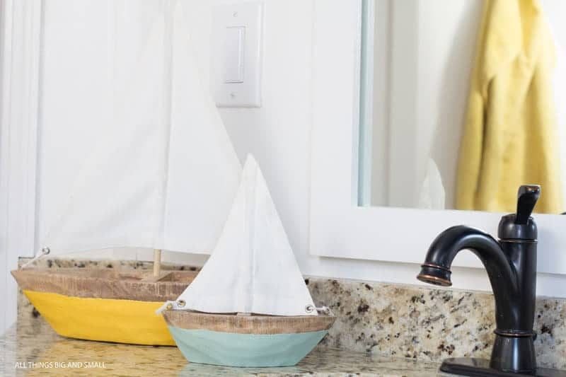 two boats on bathroom counter- kids bathroom decor ideas