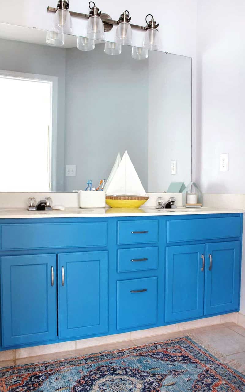 bright blue bathroom cabinets in kids bathroom
