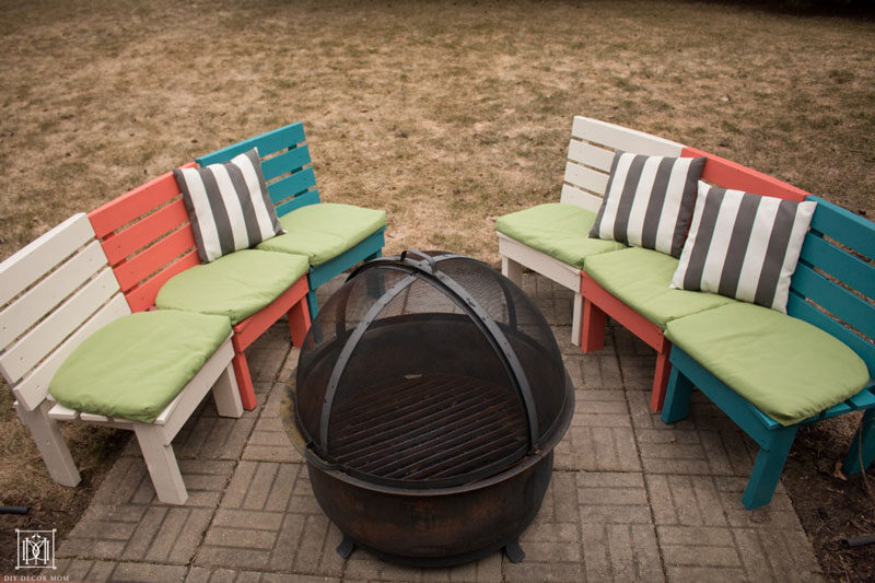 curved diy fire pit bench in rainbow colors with cushions