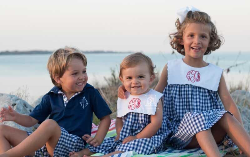 older siblings with baby on beach--tips for helping toddlers adjust to new baby