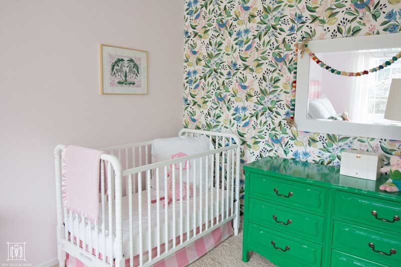 light pink little girls bedroom with wallpaper