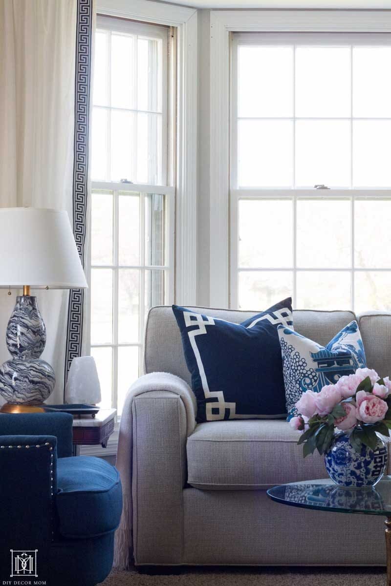 couch with blue and white pillows