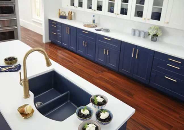 navy blue kitchen cabinets with white backsplash