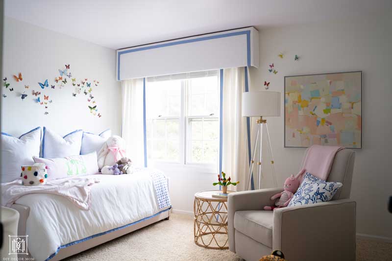 girl nursery reveal- white walls, blue and white curtains, abstract artwork