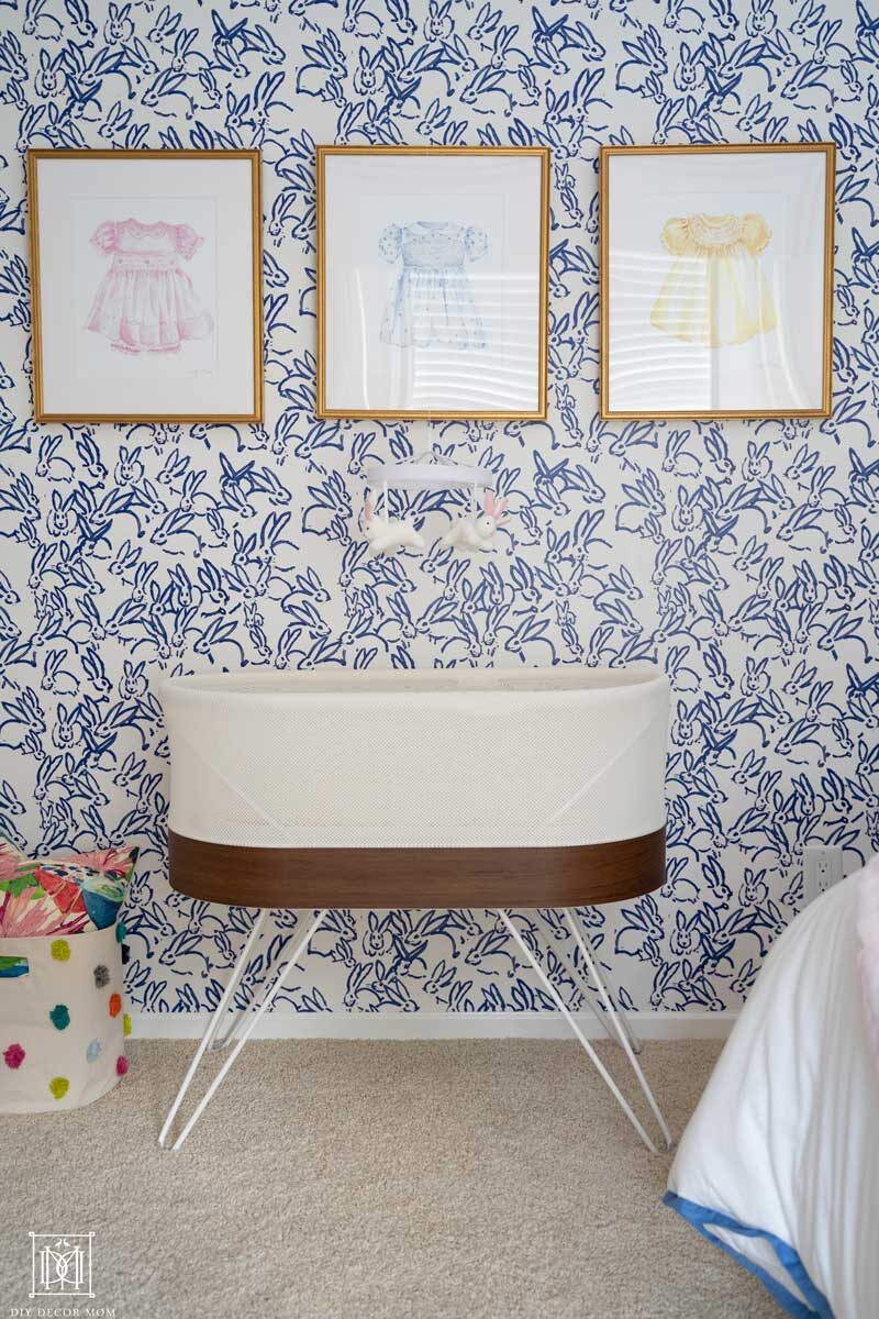 snoo in girls nursery with wallpaper accent wall