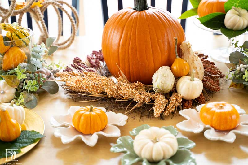 fall decorations with mini pumpkins on appetizer plates