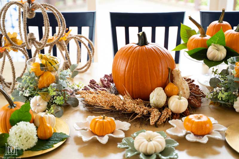 gourds and mini pumpkins as fall decorations on table