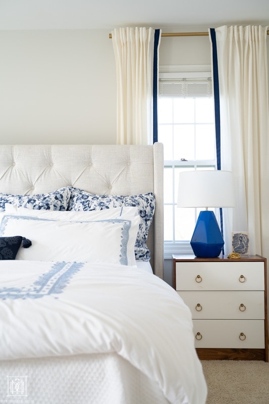 white curtains and blue and white bedding