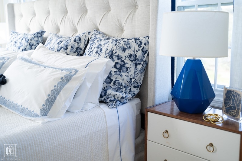 blue and white duvet cover with embroidery and floral euro pillows