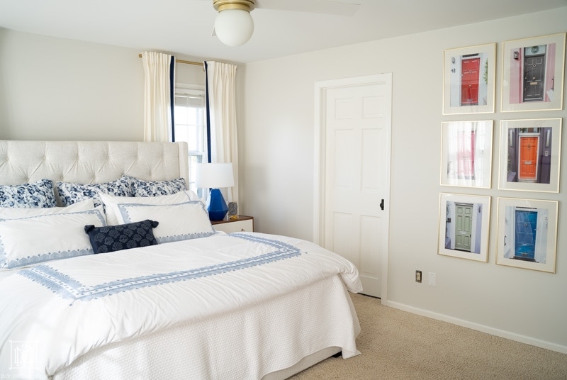 BM Classic Gray bedroom with white bedding and blue lamps