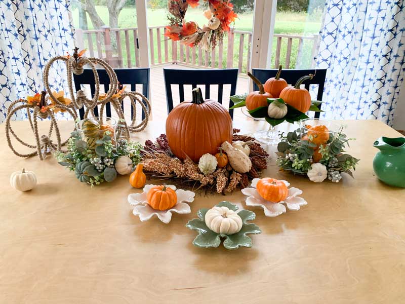 styled fall tablescape with harvest wreath on window