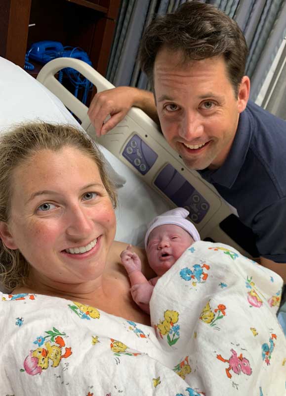 newborn baby and new mom and dad at hospital