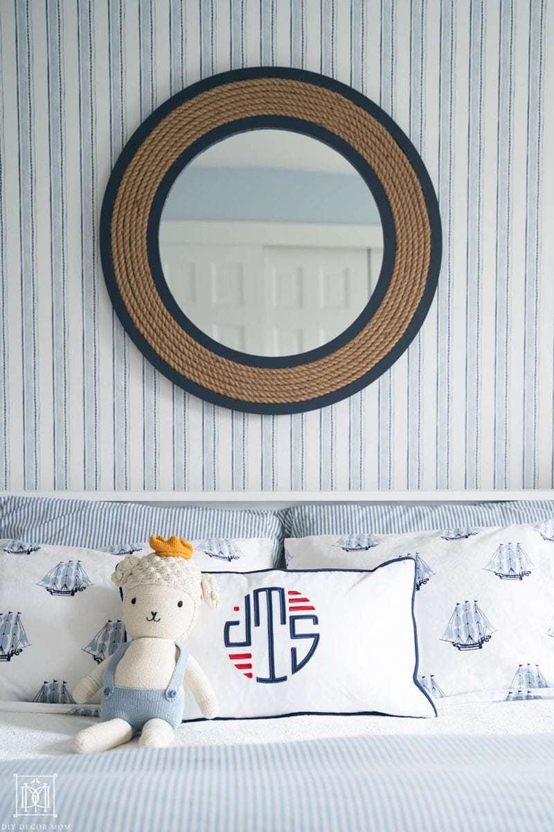 nautical mirror over bed