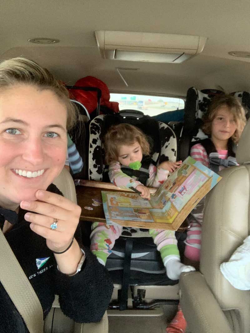 kids in back seat of car on road trip in car seats