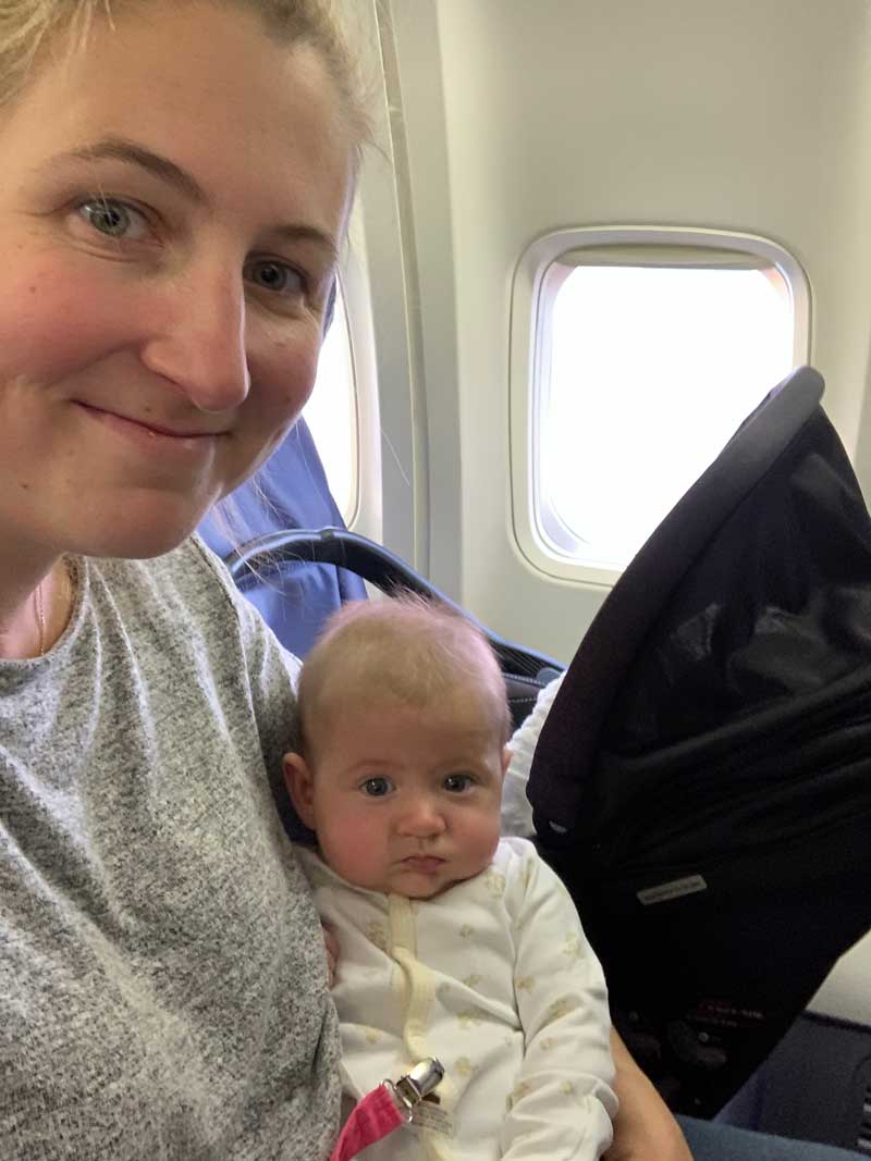 mom and baby flying on airplane