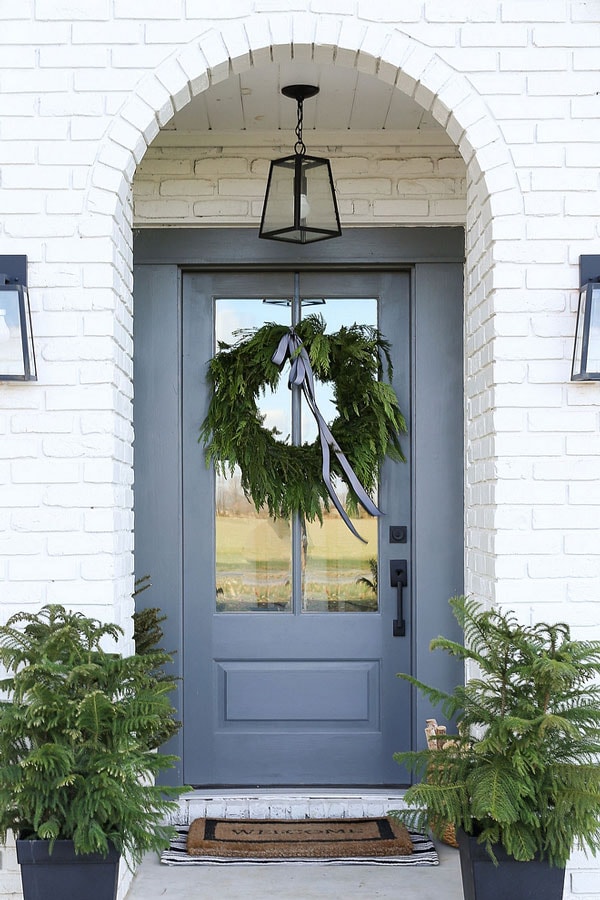 BM Chelsea Gray front door with white brick arched entryway