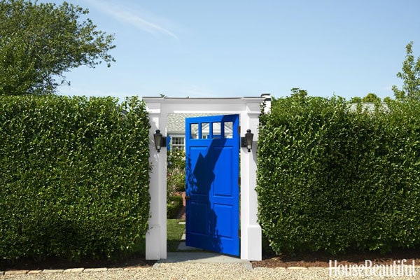 BM New York State of Mind blue door in hedge