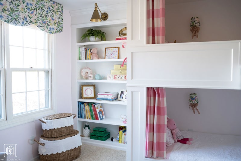 scalloped diy valance and window cornice box in shared girls bunk room with built-in bunk beds and built-in bookshelves