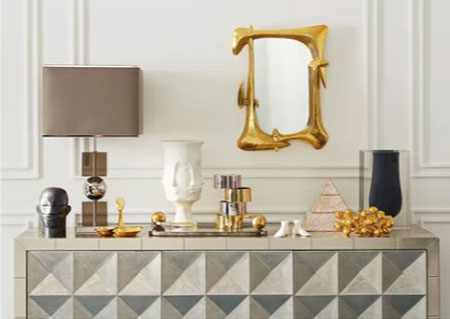 glam white foyer with picture railing and millwork featuring modern table decor