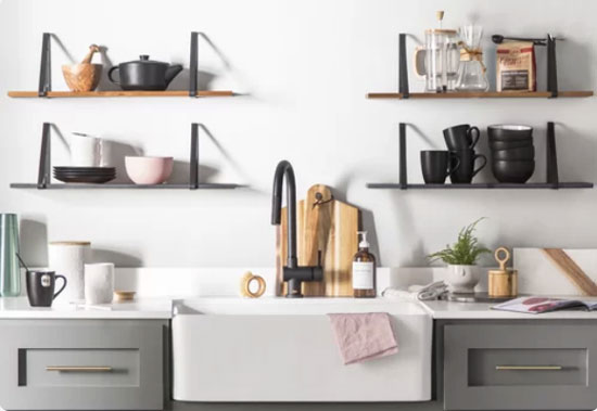 gray shaker kitchen cabinets with brass hardware