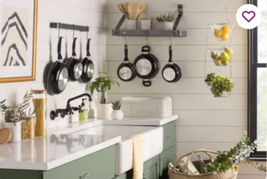 sage green colored kitchen cabinets in farmhouse style kitchen