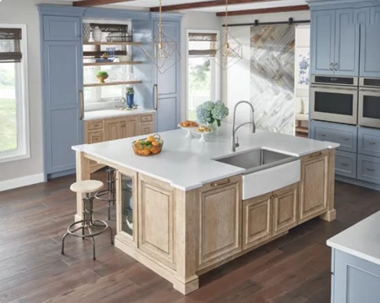 light blue painted kitchen cabinets with natural wood tone island