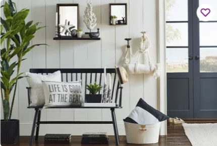 white shiplap and trim walls with black farmhouse bench