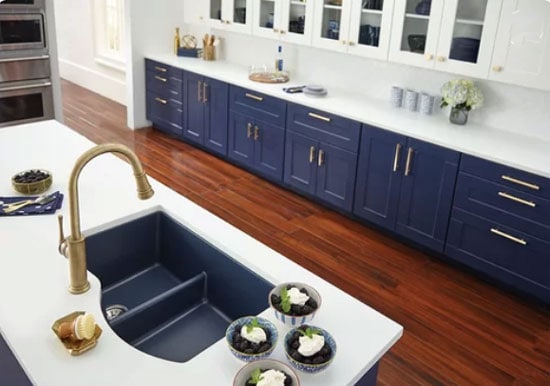 navy blue kitchen cabinets and reddish floor