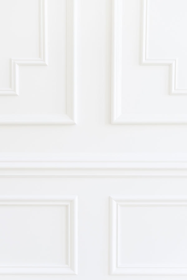 detail of white trim millwork in rachel parcell's house featuring BM Dove Wing--one of the best white trim colors