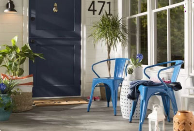 steel blue front door with coastal decor
