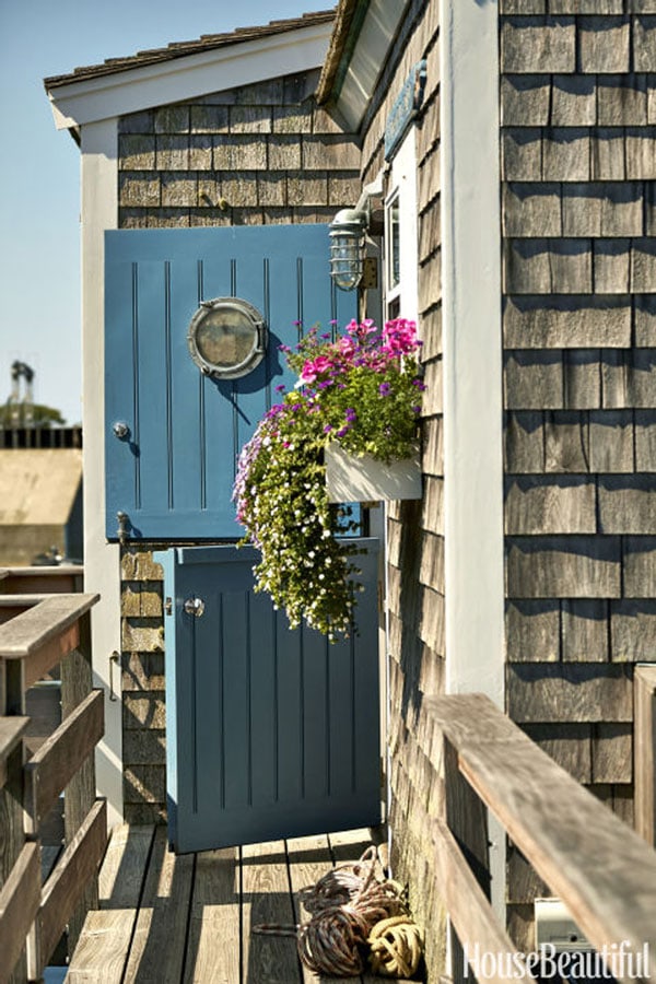 teal dutch door on shingled coastal house