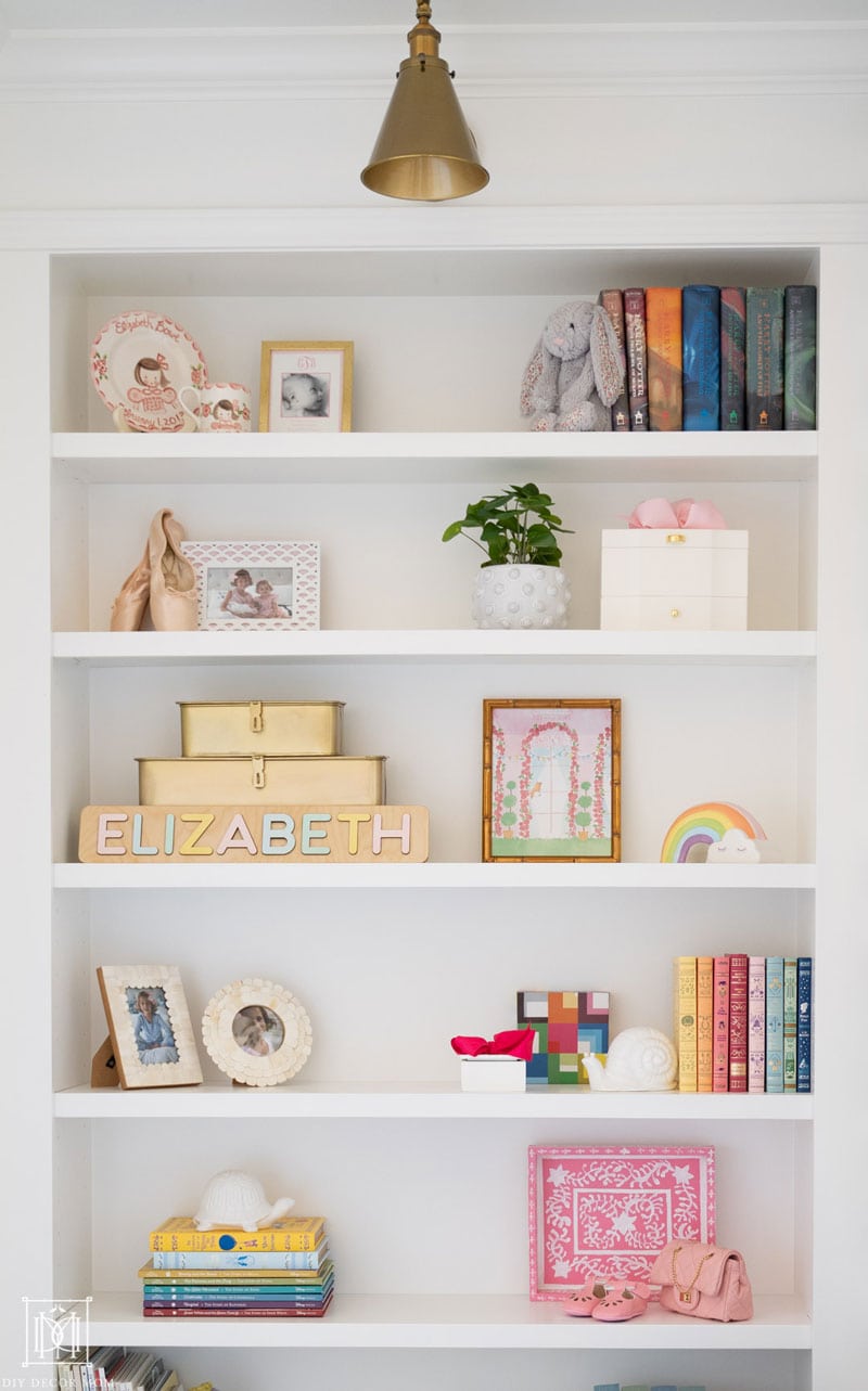 styled girls bedroom bookshelf in built-in bookcase